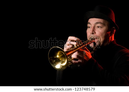 An image of a man playing the trumpet