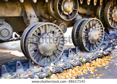 Metal wheels from the tank (an autumn season, the tank it is motionless and is in an exhibit kind)