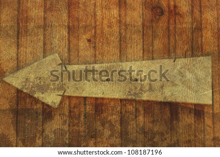 vintage background oak wood arrow pointer abstract rusty colored background.