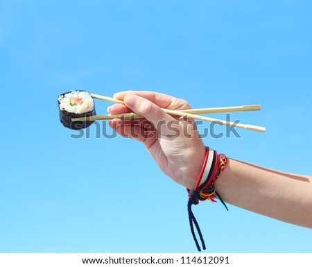 sushi hand of a young girl