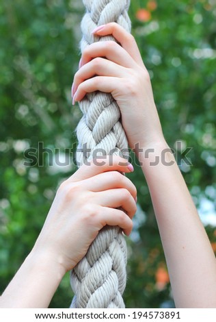girl hand rope climbing up