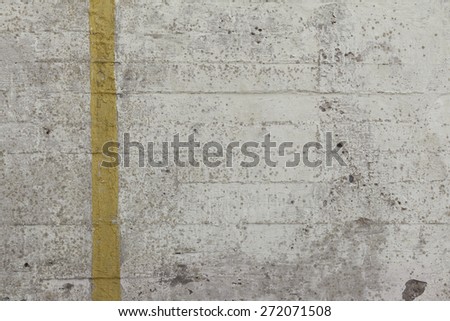 Concrete texture wall with crack chip yellow stripe