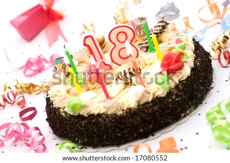 birthday cake for 18 years jubilee surrounded by streamers and gift boxes on white background