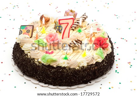 stock photo : Birthday cake 7 years with candles and glitter