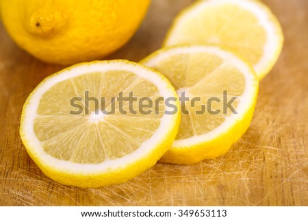 fresh lemon isolated on wooden background