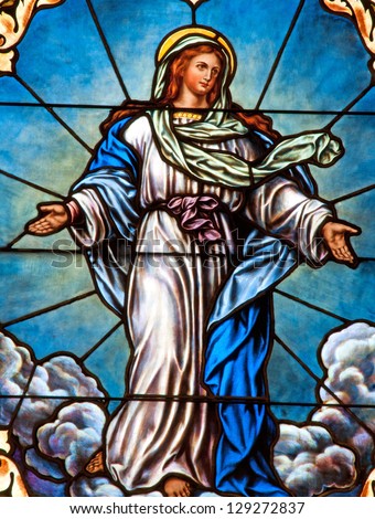 Stained Glass Window Depicting Catholic Devotion Of Assumption Of Blessed Virgin Mary Into Heaven