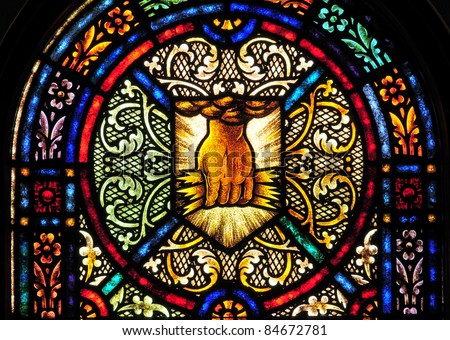 Stained glass window with symbol of \