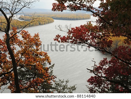 Fall scene: oak trees frame Mississippi River on a hazy day, viewed from Effigy Mounds National Monument, Iowa