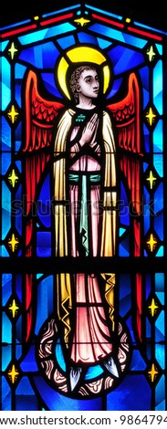 Stained glass window of angel with face turned to his left