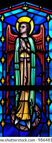 Stained glass window of angel with face turned to his right