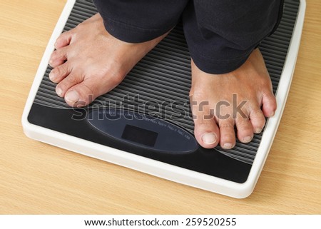 feet on digital weight scale