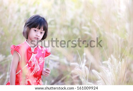 cute lovely sweet asian chinese kid girl with smiling face on the road,Chinese girl play in the park,Portrait of little Asian girl