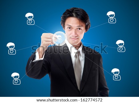 Businessman in a suit with a gold tie color holding a pen,Select team leader concept.