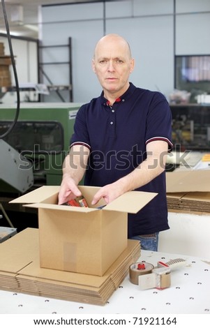 Cardboard boxes being packed in a printing works