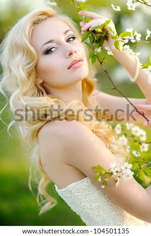 portrait of a beautiful bride in a lush garden