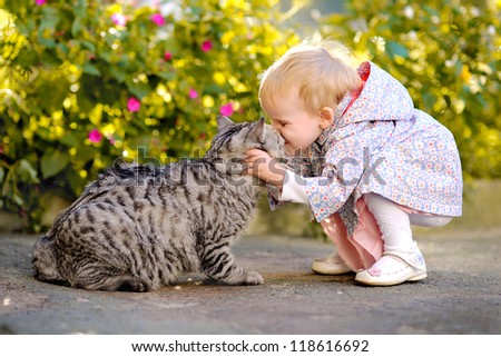 portrait of a little girl with a cat