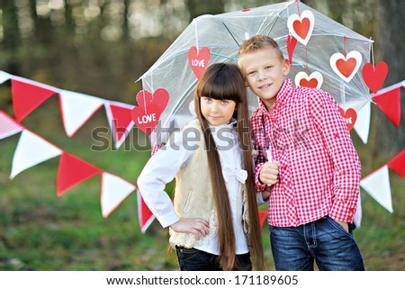 portrait of little boy and girl with decor style Valentine\'s Day