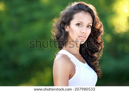 portrait of a beautiful brunette in a sporting manner