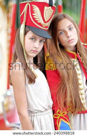 portrait of two girls in the style of hussars