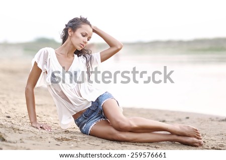 portrait of a beautiful young girl  in wet shirt