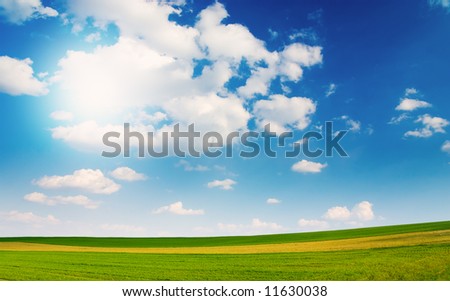 Large piece of land and blue cloudy sky (can be used how background or wallpaper)