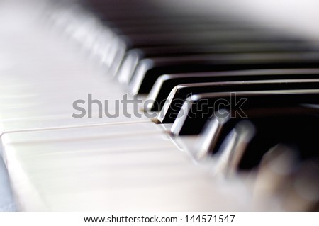 Closeup of a pianos black and white keys. Selective focus with shallow depth of field.