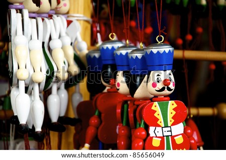 Several different wooden Jumping Jacks hanging in an oldfashioned toy shop