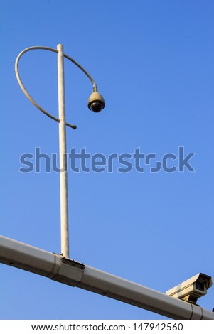 Road camera monitor in the blue sky