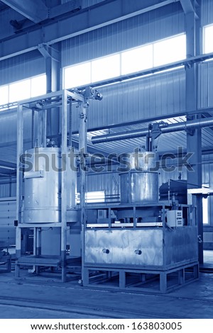 manufacturing production line filling equipment in a workshop