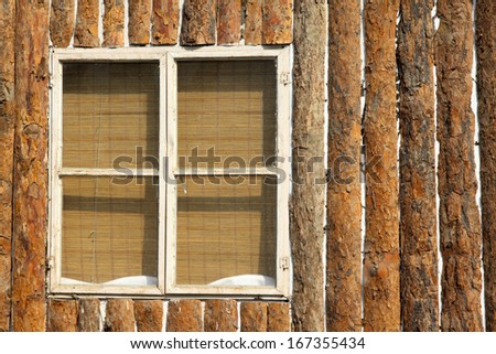 glass window and brown wooden wall in a scenic area, in northern China.