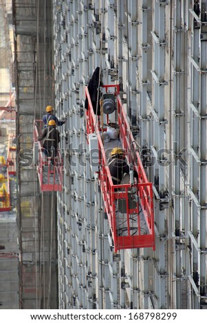 Luannan County, May 18: Construction Workers In High Rise Building Doing Decoration Works On May 18, 2012, Luannan County, Hebei Province, China