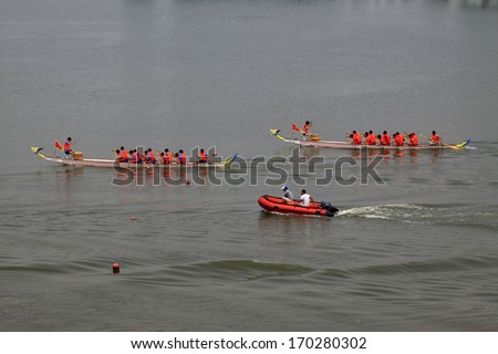 LUANNAN - JUNE 15: The dragon boat race scene in Chinese traditional Dragon Boat Festival on June 15, 2013, Luannan, Hebei Province, China.