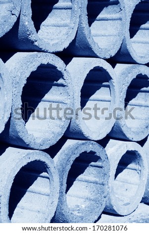 clay drain pipe stacked together in a warehouse