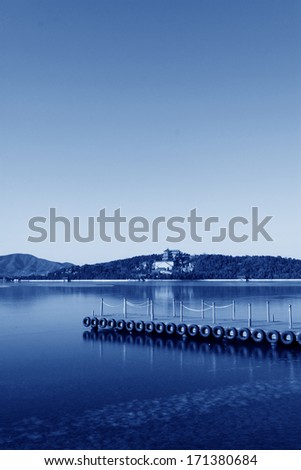 dock and the tower of Buddhist incense in Kunming Lake, in the Summer Palace on December 10, 2011, Beijing, china.