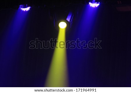 stage lighting effect in the darkness, closeup of photo