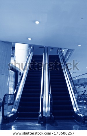 modern escalator in a hotel lobby, closeup of pictures.