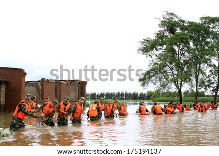 Luannan, August 4: Chinese armed police soldiers flood fighting and emergency rescues on August 4, 2012, Luannan, Hebei, China.