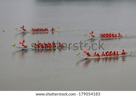 LUANNAN, CHINA - JUNE 15: Dragon boat race scene in Chinese traditional Dragon Boat Festival on June 15, 2013, Luannan, Hebei Province, China.