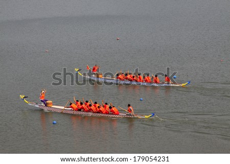 LUANNAN, CHINA - JUNE 13: Dragon boat race scene in Chinese traditional Dragon Boat Festival on June 13, 2013, Luannan, Hebei Province, China.