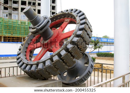 Big gear in an industrial park, closeup of photo