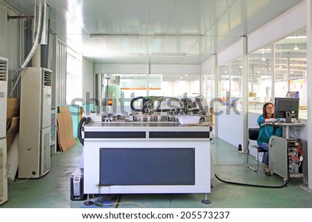 TANGSHAN CITY - MAY 28: Large ink jet printers in a production workshop, on may 28, 2014, Tangshan city, Hebei Province, China