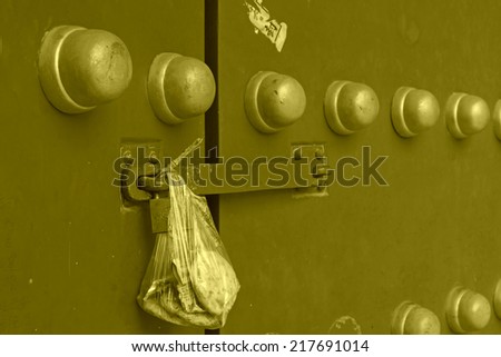 containing food plastic bag hang at the door, beijing, china