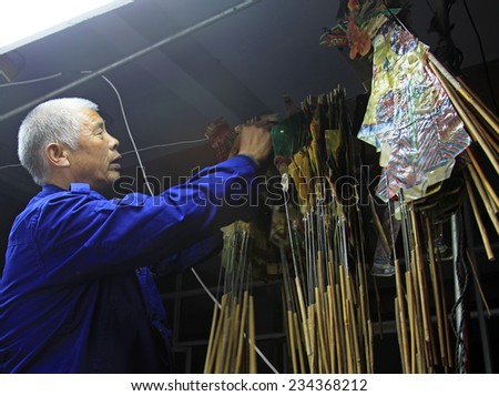 LUANNAN COUNTY- OCTOBER 3: Shadow puppet artists arranging props, on october 3, 2014, Luannan, Hebei Province, china.