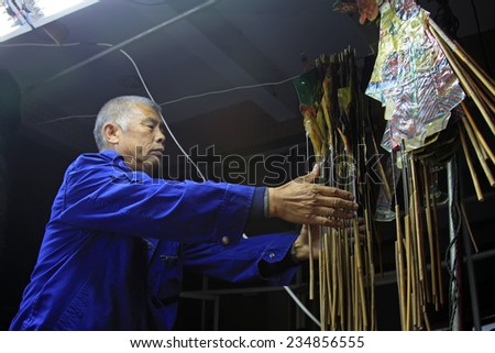 LUANNAN COUNTY- OCTOBER 3: Shadow puppet artists arranging props, on october 3, 2014, Luannan, Hebei Province, china.