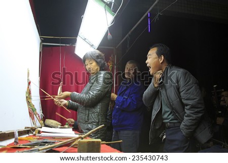 LUANNAN COUNTY- OCTOBER 2: Shadow puppet artists arranging props, on october 2, 2014, Luannan, Hebei Province, china.