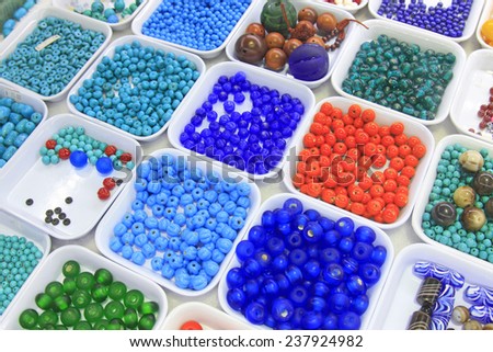 Color bead in plastic tray, closeup of photo