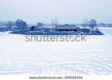 unfinished building on the frozen river, north china