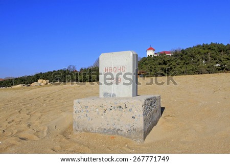Stone tablets on the beach, closeup of photo
