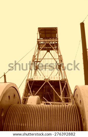 Industrial stage winch for shaft sinking and drilling derrick in MaCheng iron mine on July 12, 2012, Luannan County, Hebei Province, China