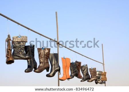 women\'s boots hanging in the air